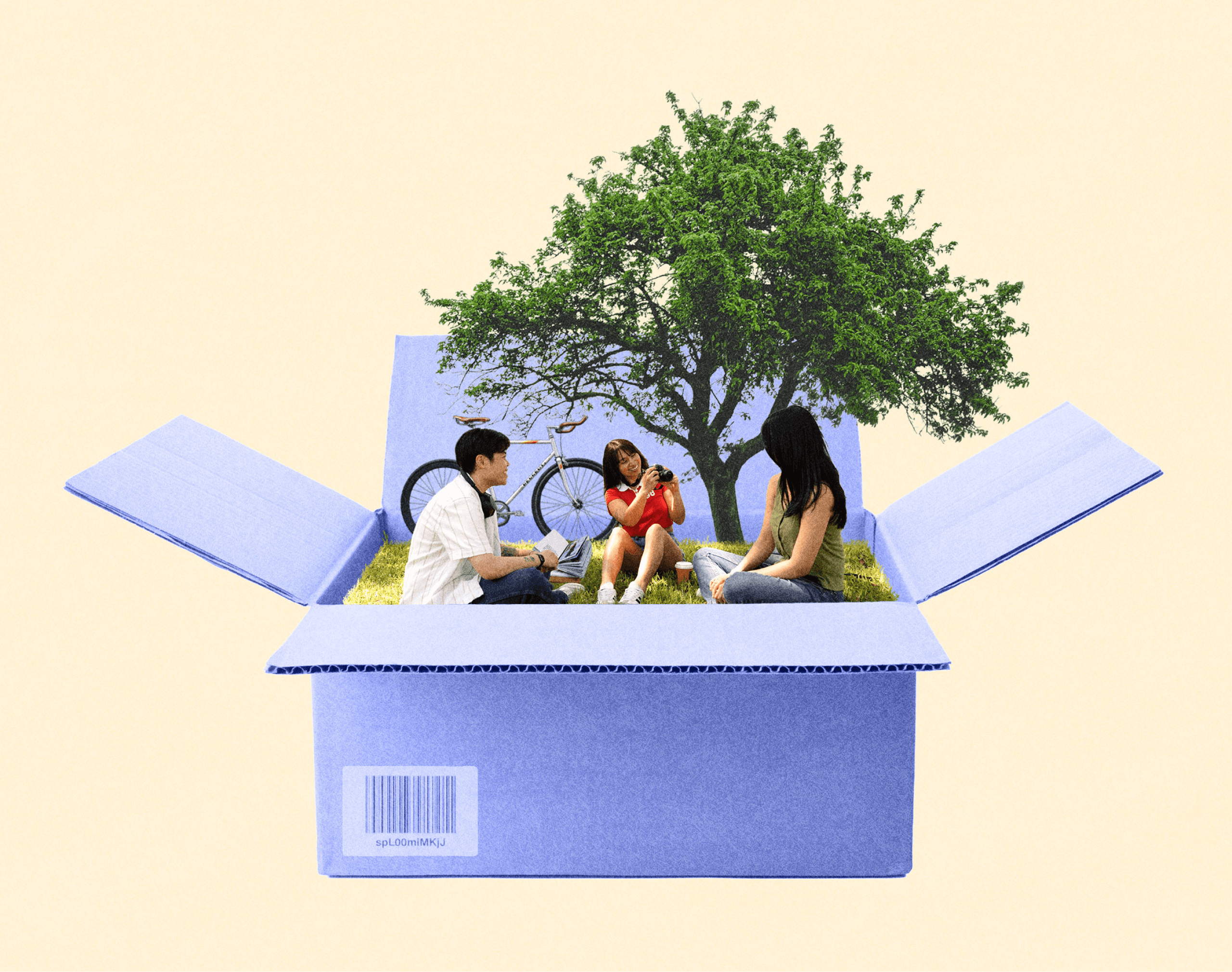Friends picnicking inside an open cardboard box